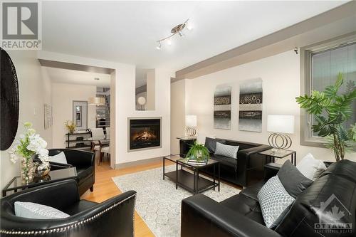 Looking to the rear and the dining room - 474 Sunnyside Avenue, Ottawa, ON - Indoor Photo Showing Living Room With Fireplace