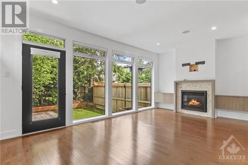 Living room - 135 Carleton Avenue, Ottawa, ON - Indoor Photo Showing Other Room With Fireplace