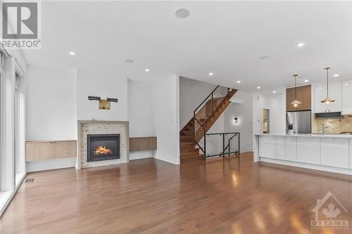 Living room with gas fire place - 135 Carleton Avenue, Ottawa, ON - Indoor With Fireplace