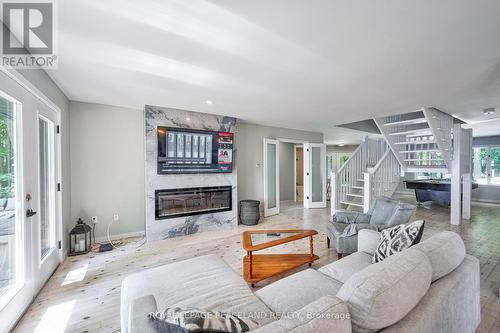 317 Riverside Drive, Kawartha Lakes, ON - Indoor Photo Showing Living Room With Fireplace