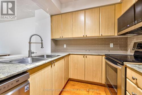 303 - 763 Bay Street, Toronto (Bay Street Corridor), ON - Indoor Photo Showing Kitchen With Double Sink