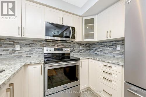 212 - 1050 The Queensway, Toronto (Islington-City Centre West), ON - Indoor Photo Showing Kitchen With Upgraded Kitchen