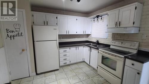 Kitchen with fridge and stove included - 162 - 1775 Culver Drive, London, ON - Indoor Photo Showing Kitchen With Double Sink