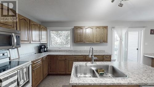 9024 114 Avenue, Fort St. John, BC - Indoor Photo Showing Kitchen With Double Sink