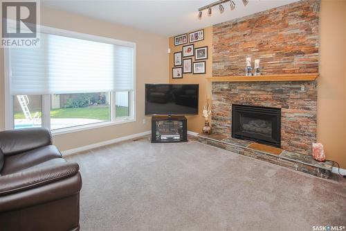 206 Braeshire Lane, Saskatoon, SK - Indoor Photo Showing Living Room With Fireplace