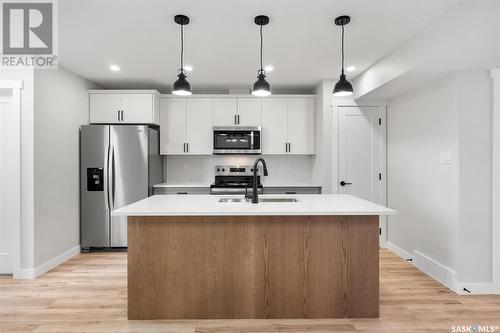 2977 Green Stone Road E, Regina, SK - Indoor Photo Showing Kitchen With Double Sink With Upgraded Kitchen