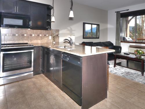 822A - 800 Bighorn Boulevard, Radium Hot Springs, BC - Indoor Photo Showing Kitchen With Double Sink With Upgraded Kitchen