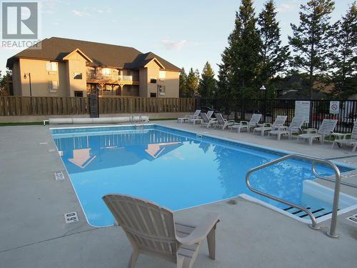 800 Bighorn Boulevard Unit# 822A, Radium Hot Springs, BC - Outdoor With In Ground Pool With Backyard