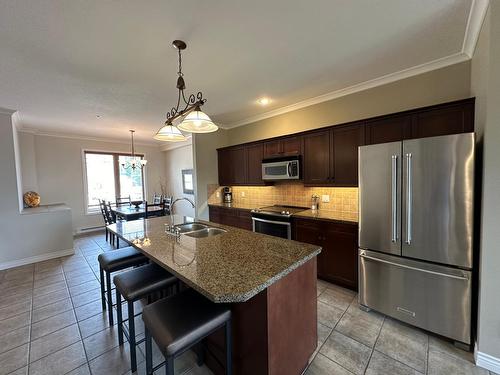 234C - 200 Bighorn Boulevard, Radium Hot Springs, BC - Indoor Photo Showing Kitchen With Double Sink