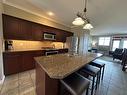 234C - 200 Bighorn Boulevard, Radium Hot Springs, BC  - Indoor Photo Showing Kitchen With Double Sink With Upgraded Kitchen 