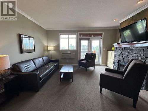 200 Bighorn Boulevard Unit# 234C, Radium Hot Springs, BC - Indoor Photo Showing Living Room With Fireplace