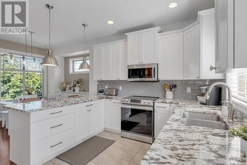 4943 Windsong Crescent, Kelowna, BC - Indoor Photo Showing Kitchen With Double Sink With Upgraded Kitchen