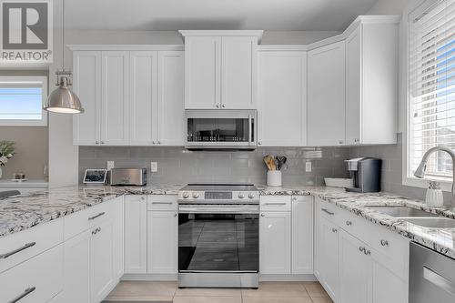 4943 Windsong Crescent, Kelowna, BC - Indoor Photo Showing Kitchen With Double Sink With Upgraded Kitchen