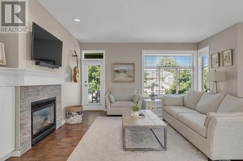 4943 Windsong Crescent, Kelowna, BC - Indoor Photo Showing Living Room With Fireplace