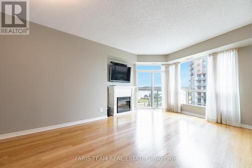 707 - 33 Ellen Street, Barrie (City Centre), ON - Indoor Photo Showing Other Room With Fireplace