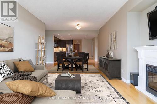 707 - 33 Ellen Street, Barrie (City Centre), ON - Indoor Photo Showing Living Room With Fireplace