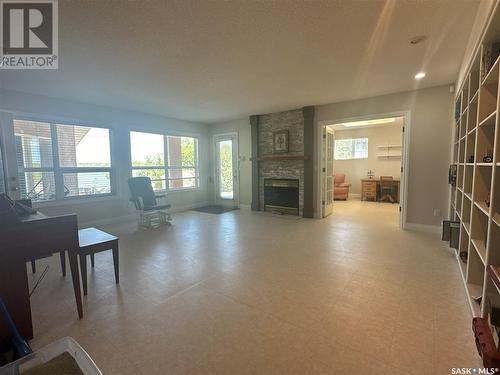 100 Centre Street, Regina Beach, SK - Indoor Photo Showing Living Room With Fireplace