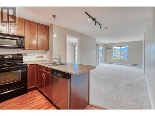 256 Hastings Avenue Unit# 212, Penticton, BC - Indoor Photo Showing Kitchen With Double Sink