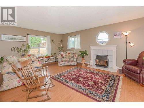 4420 Schubert Road, Spallumcheen, BC - Indoor Photo Showing Living Room With Fireplace