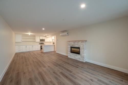 209-217 Elm Avenue, Penticton, BC - Indoor Photo Showing Living Room With Fireplace