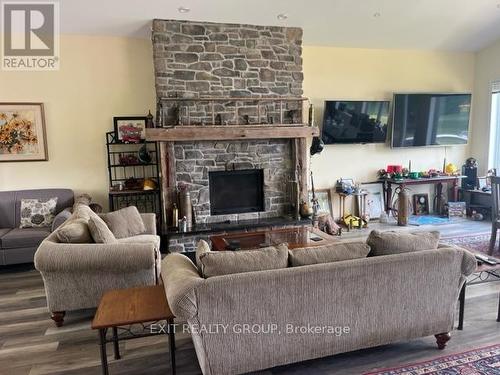 682 Whitney Road, Prince Edward County (Ameliasburgh), ON - Indoor Photo Showing Living Room With Fireplace