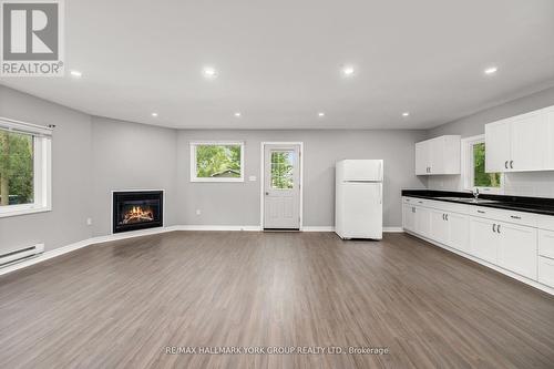 3554 John Street, Ramara (Brechin), ON - Indoor With Fireplace