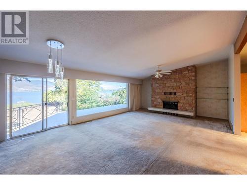 102 Derenzy Place, Penticton, BC - Indoor Photo Showing Living Room With Fireplace