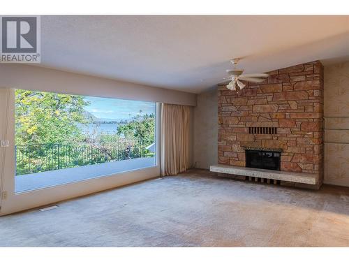 102 Derenzy Place, Penticton, BC - Indoor Photo Showing Living Room With Fireplace