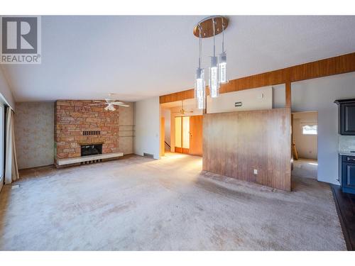 102 Derenzy Place, Penticton, BC - Indoor Photo Showing Living Room With Fireplace