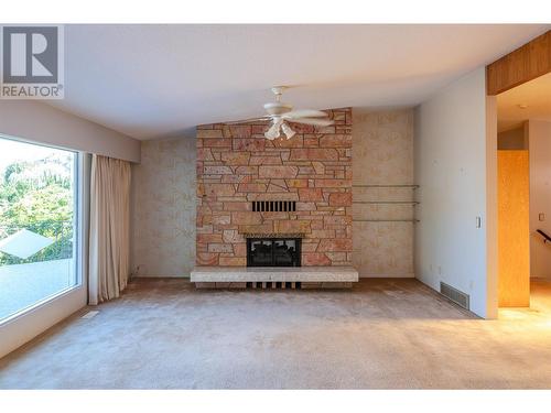 102 Derenzy Place, Penticton, BC - Indoor Photo Showing Living Room With Fireplace