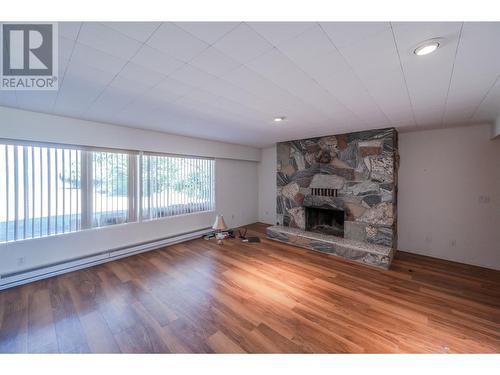 102 Derenzy Place, Penticton, BC - Indoor Photo Showing Living Room With Fireplace