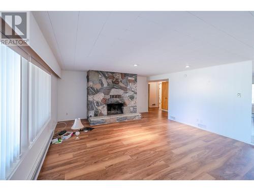 102 Derenzy Place, Penticton, BC - Indoor Photo Showing Living Room With Fireplace