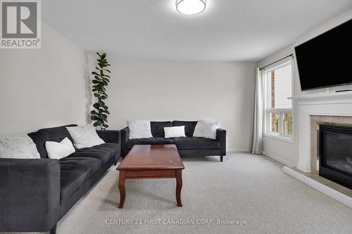 250 White Sands Drive, London, ON - Indoor Photo Showing Living Room With Fireplace