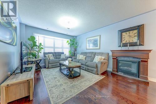 99 Mondeo Drive, Toronto (Dorset Park), ON - Indoor Photo Showing Living Room With Fireplace