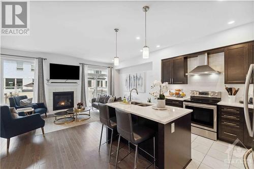 13 Brixton Way, Ottawa, ON - Indoor Photo Showing Kitchen With Fireplace With Double Sink With Upgraded Kitchen