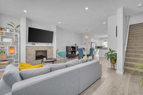 80-2490 Tuscany Drive, West Kelowna, BC - Indoor Photo Showing Living Room With Fireplace