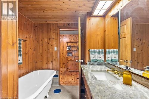 New porcelain floors and granite on the vanity top. - 579 Cape Hurd Road, Tobermory, ON - Indoor Photo Showing Bathroom