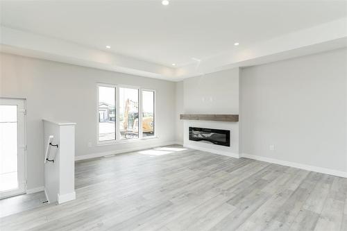 199 Wyndham Estate Drive, Steinbach, MB - Indoor Photo Showing Living Room With Fireplace