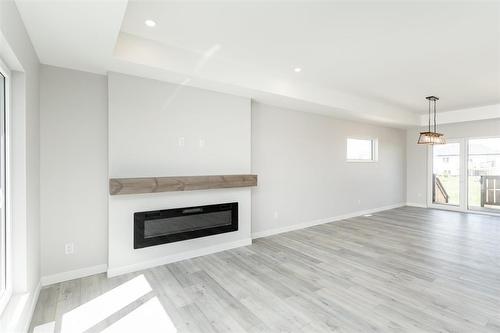 199 Wyndham Estate Drive, Steinbach, MB - Indoor Photo Showing Living Room With Fireplace