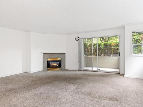 101-1714 Fort St, Victoria, BC - Indoor Photo Showing Living Room With Fireplace