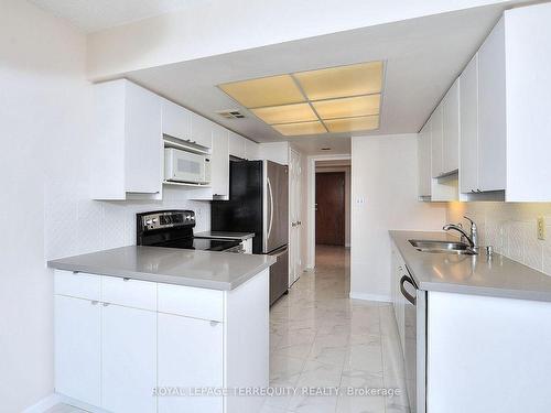 1204-10 Torresdale Ave, Toronto, ON - Indoor Photo Showing Kitchen With Double Sink