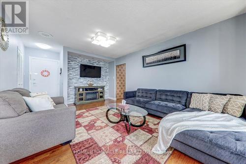 1604 - 100 Prudential Drive, Toronto (Dorset Park), ON - Indoor Photo Showing Living Room With Fireplace