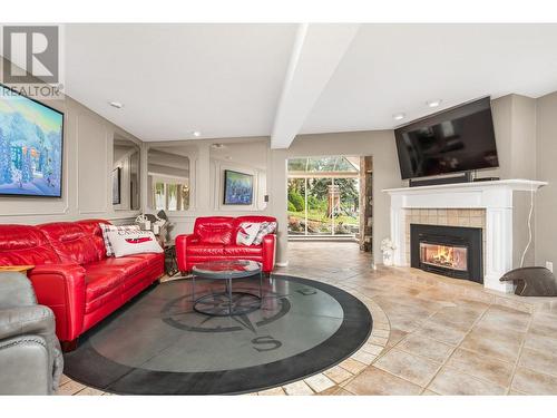 8180 Tronson Road, Vernon, BC - Indoor Photo Showing Living Room With Fireplace