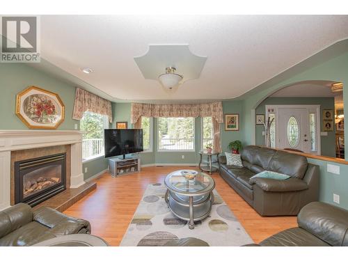 7775 Chew Road, Vernon, BC - Indoor Photo Showing Living Room With Fireplace