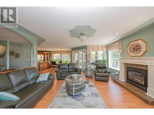 7775 Chew Road, Vernon, BC - Indoor Photo Showing Living Room With Fireplace