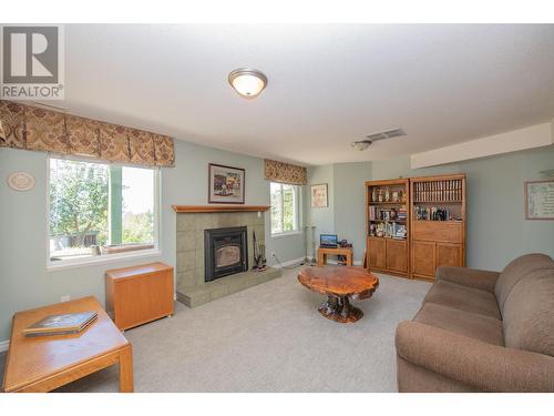 7775 Chew Road, Vernon, BC - Indoor Photo Showing Living Room With Fireplace