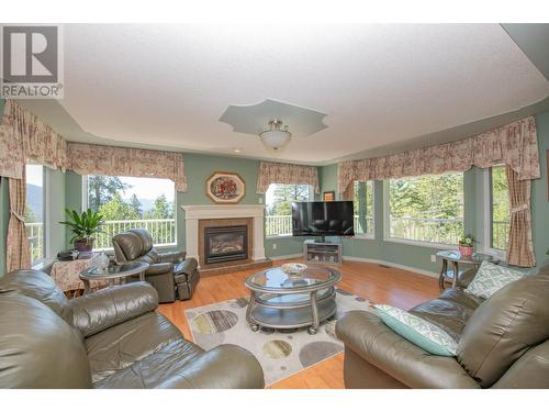 7775 Chew Road, Vernon, BC - Indoor Photo Showing Living Room With Fireplace