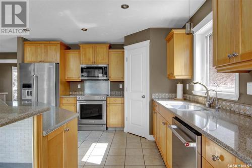 14 Emerald Ridge, White City, SK - Indoor Photo Showing Kitchen With Stainless Steel Kitchen With Double Sink