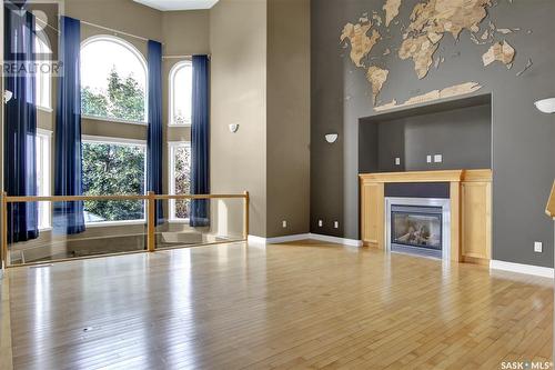 14 Emerald Ridge, White City, SK - Indoor Photo Showing Living Room With Fireplace