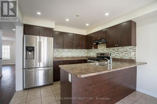 7 Brigham Avenue, Hamilton (Binbrook), ON - Indoor Photo Showing Kitchen With Stainless Steel Kitchen With Double Sink With Upgraded Kitchen